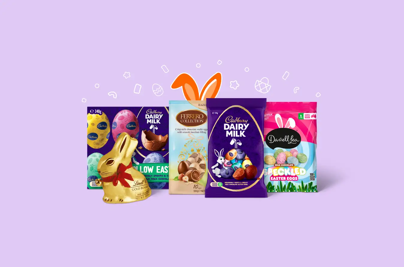 An assortment of Easter chocolates including a Lindt Gold Bunny, Cadbury Dairy Milk hollow eggs and bags, Ferrero Collection eggs and Darrell Lea speckled eggs.